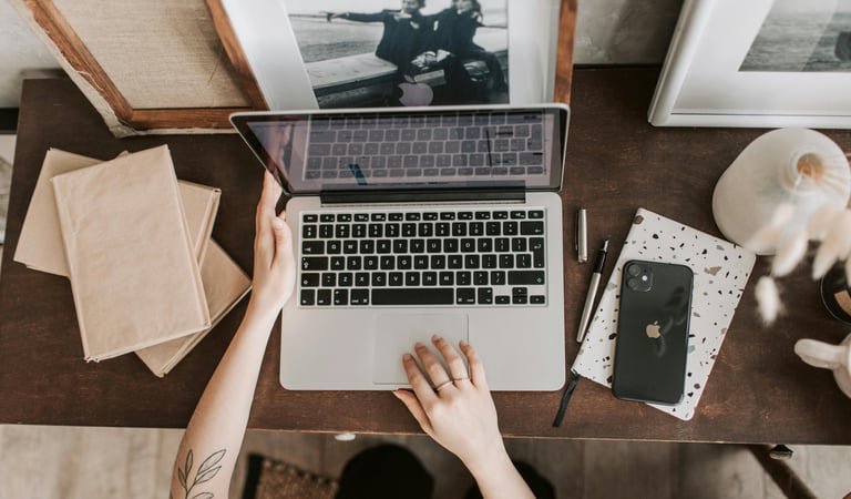 A laptop screen is open, used to refer to SEO work that I have done