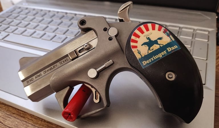 bond arms with Derringer Dan grip on a laptop