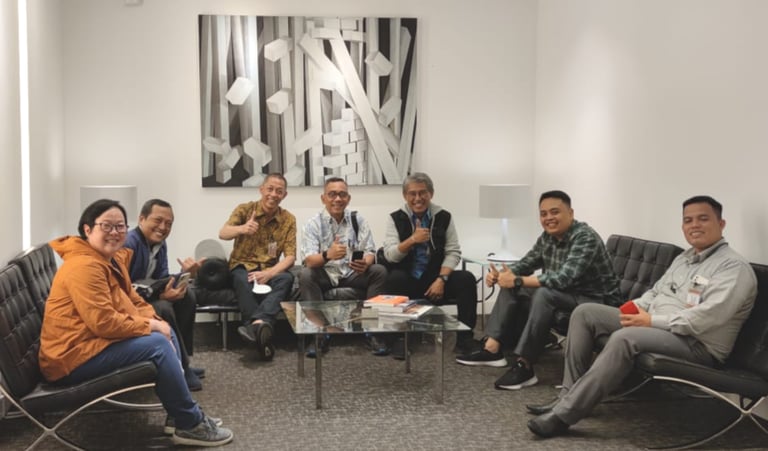 a group of people sitting around a table