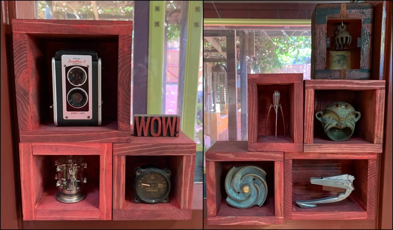 Eight red boxes filled with various metal objects.
