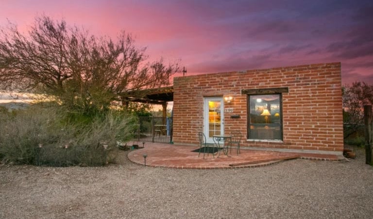 a brick building with a patio and a patio