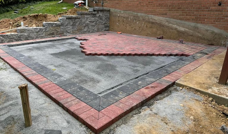"Stone patio design by Profaster Services for outdoor spaces in Des Moines."