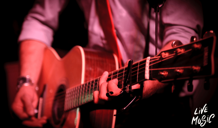 a man playing a guitar