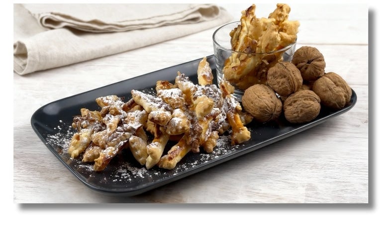 Biscottini di pasta sfoglia con marmellata e noci ricetta