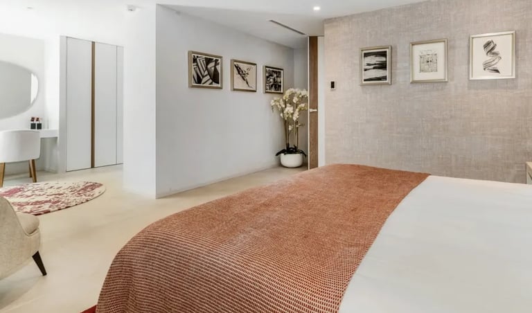 Bedroom with warm tones and garden view at Villa Serenity