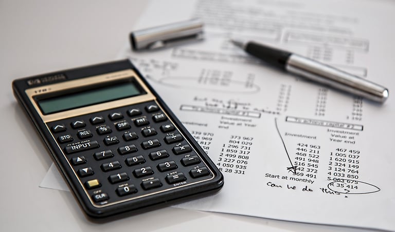 Calculator and financial papers representing financial translations