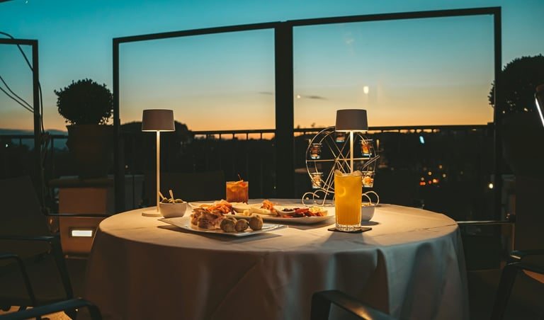 Romantic sunset terrace dining, European cuisine, elegant outdoor restaurant ambiance