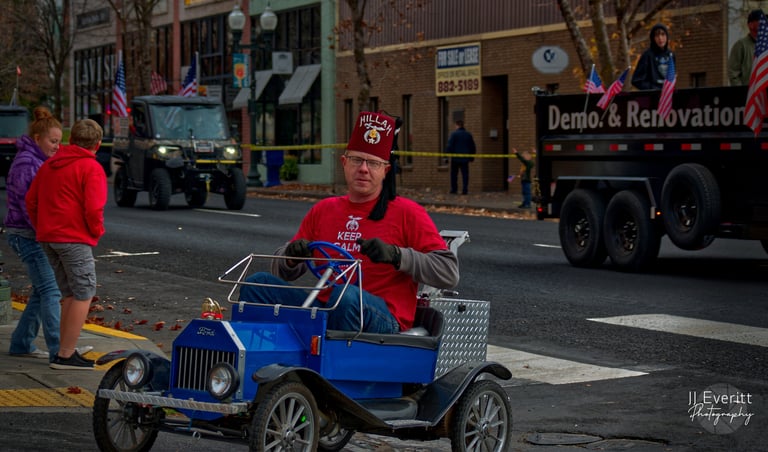 a man in a red shirt and a blue go-cart 