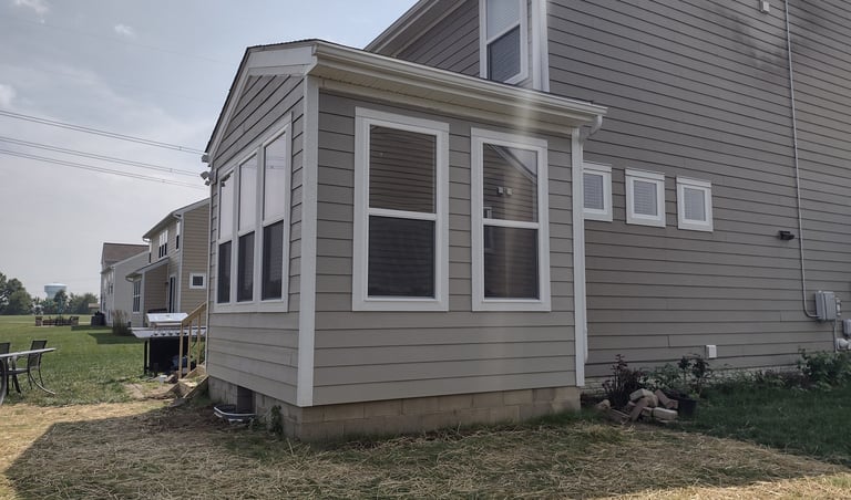 Enclosed sunroom addition protecting from weather and insects in Columbus, Ohio