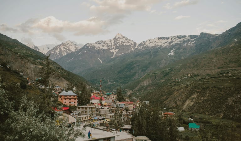 a mountain view of a town with a mountain in the background
