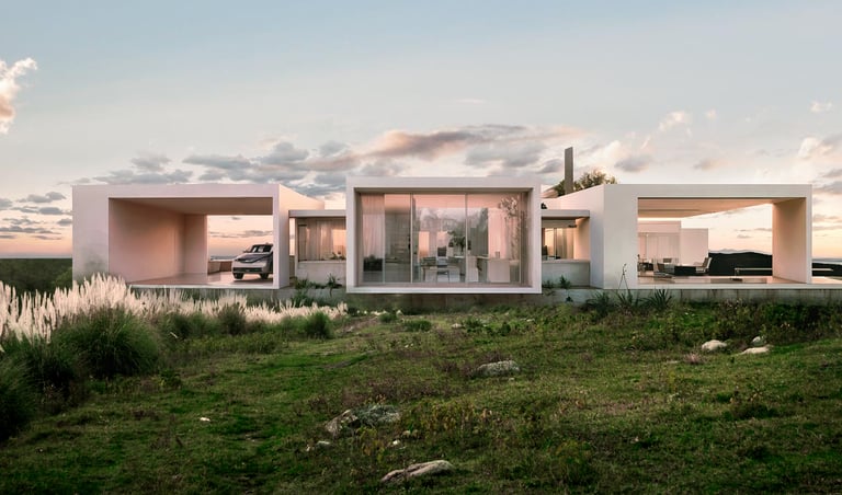 Una casa minimalista de bloques blancos integrada al paisaje y la topografía en Estación del Carmen. Malagueño. Arquitectura