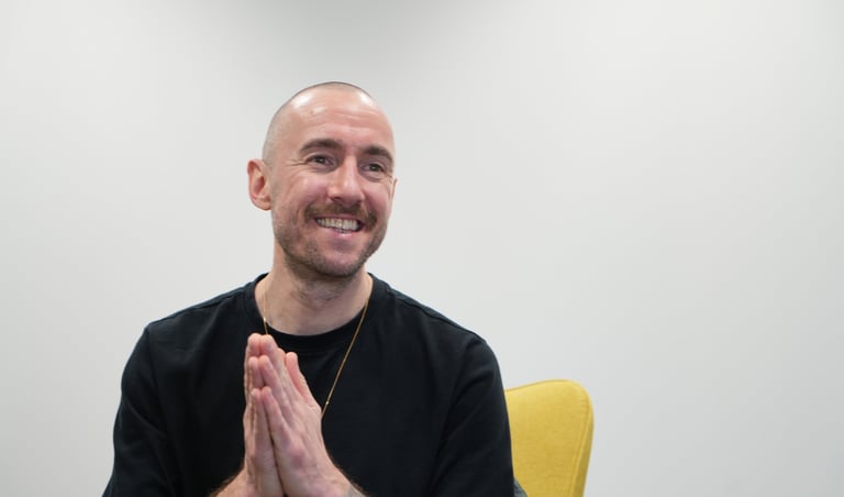 meditation teacher in black t shirt smiling