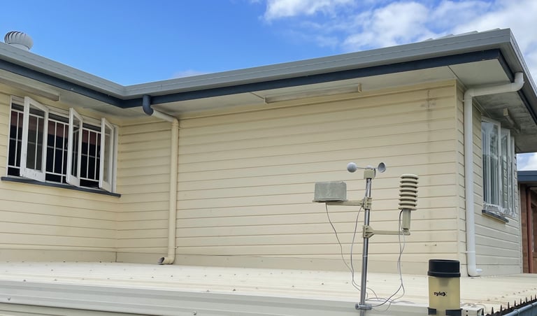 Before exterior repainting in Zillmere showing weathered house exterior and wall surfaces