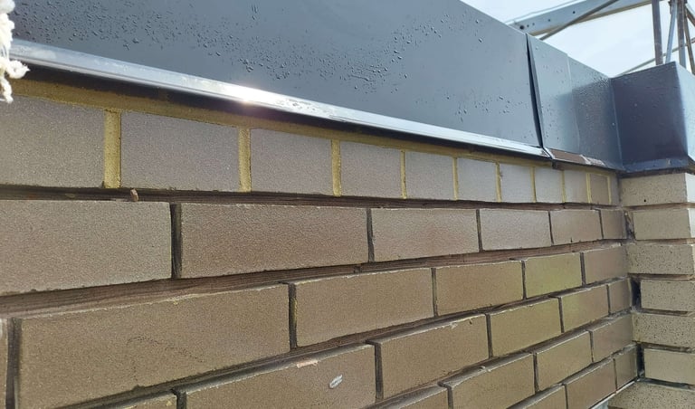 "Tuckpointing and mortar repair on a brick wall by Profaster in Des Moines."