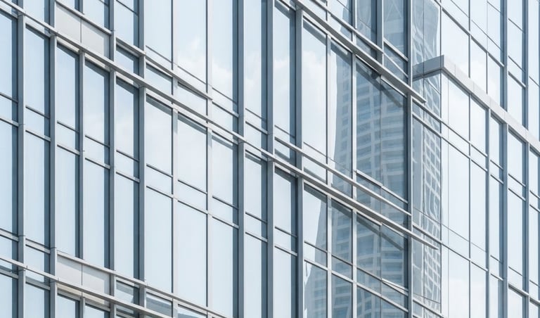 Minimalist abstract Dubai architectural lines, clean steel and glass facade reflecting bright morning sky, high-key daylight, architectural photography.