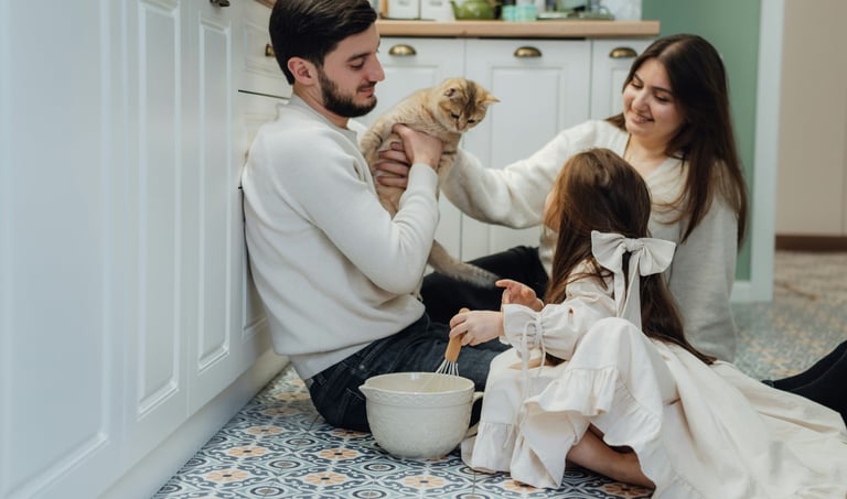 Joyful family enjoying time together in a spotless kitchen cleaned by KLEAN WELL professionals