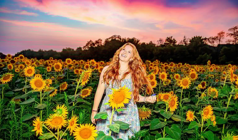 Senior Picture in a sunflower field by a professional senior picture photographer in Hershey PA