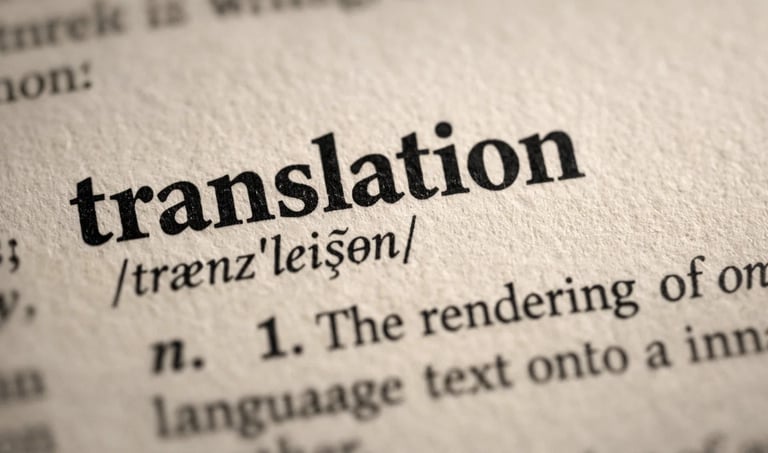 Close-up of the word translation and its phonetic spelling in a dictionary with a shallow depth of field.