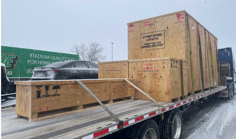 A VK Logistics truck loaded with freight driving along a highway at snowy.