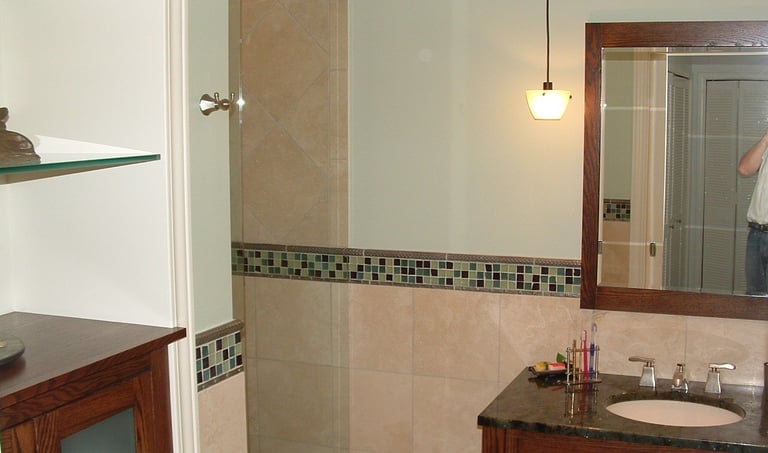 “Modern bathroom remodeled in Deer Park with walk-in shower and updated vanity by WESHORN