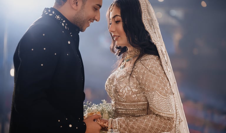 a bride and groom are standing in front of a crowd