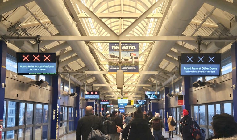 JFK AirTrain platform with the rean and blue X indicators