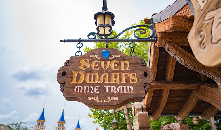 Seven Dwarfs Mine Train entrance sign at Disney's Magic Kingdom® Park.