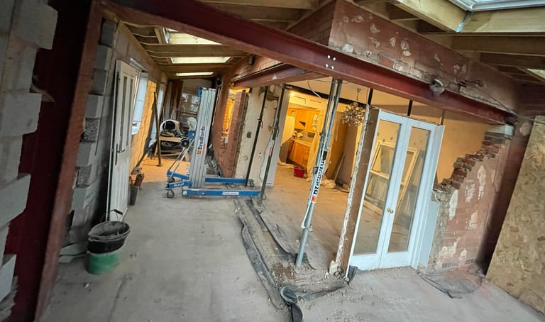 Living room and kitchen combined through building alterations in Malvern