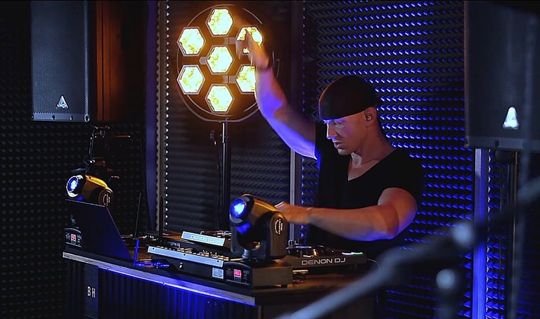 a man in a black shirt and a laptop