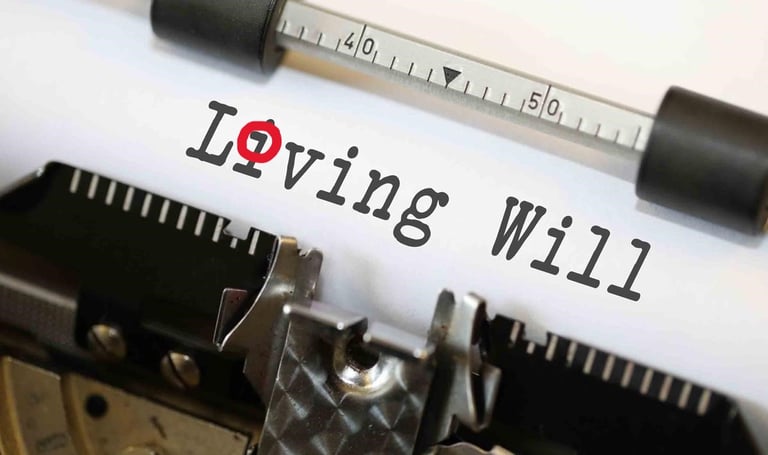 Close-up of a vintage typewriter with the words Living Will typed on a white sheet of paper.