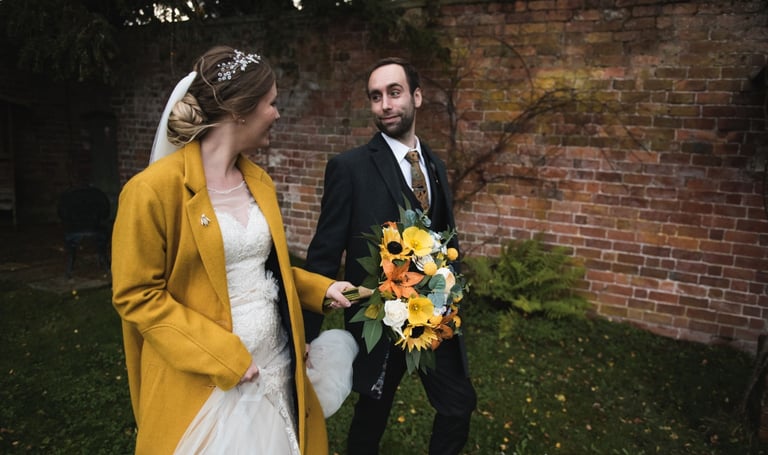 Bride and Groom holding hands and walking together