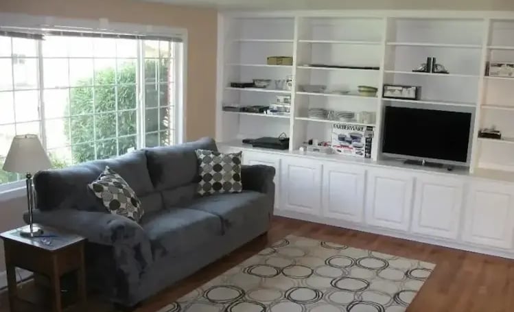 Furnished living room with built-in shelving at Malad House. Premium off-campus Boise State student housing near BSU.