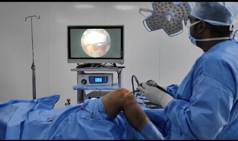 Surgeon performing minimally invasive arthroscopic surgery on a patient's knee.