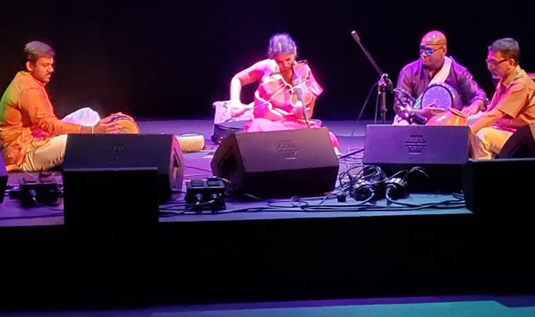 A picture of artists performing in an auditorium