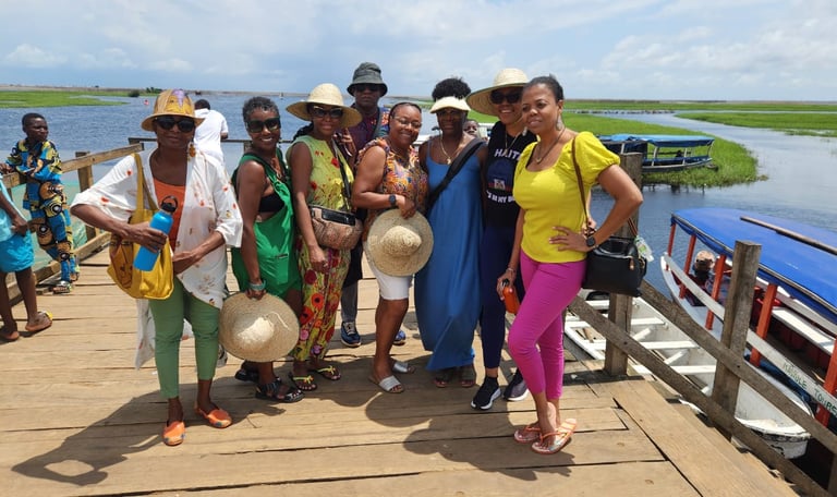Haitian Diasporas visiting Ganvie Stilt Village in Benin during A multi-country tours