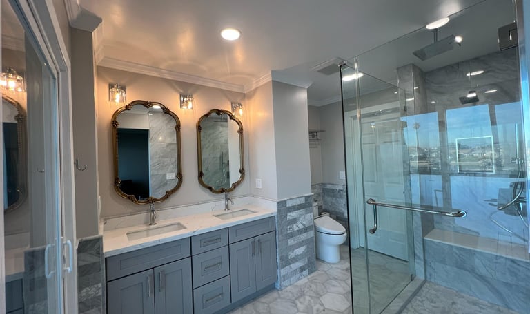 Bathroom renovation with modern finishes by Asha Construction