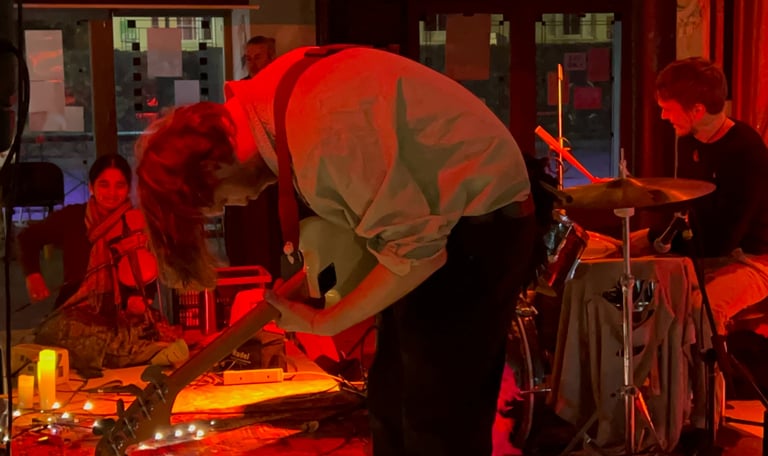 A picture of artists playing their instruments