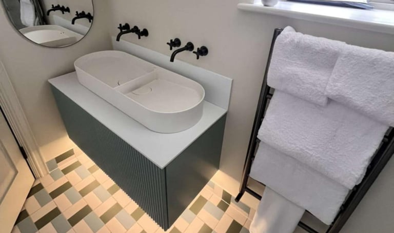 Close-up of modern sink installation with chrome mixer tap by PBP Services