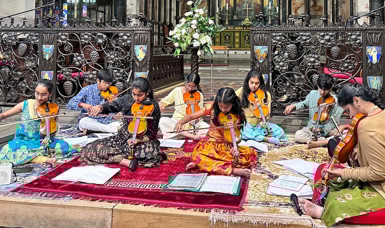 A picture of Srividya Venkat and students performing