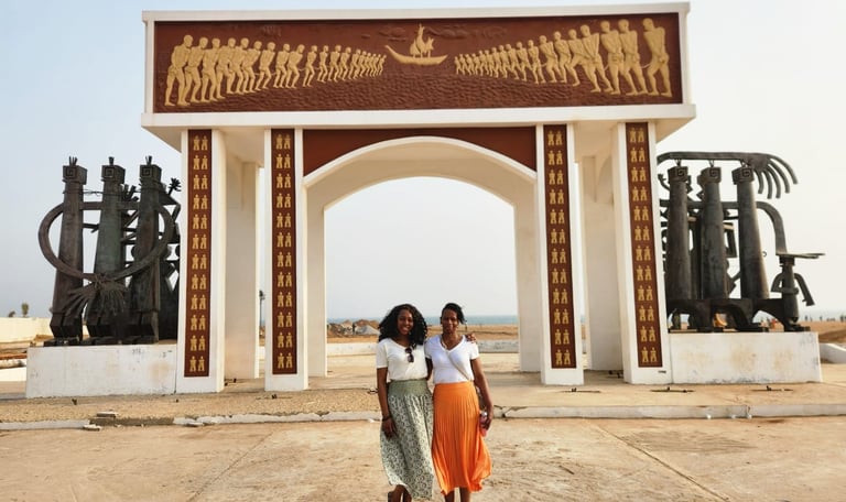 Tourists visiting Slave Door of No Return in Benin