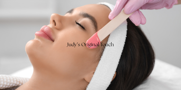 a woman getting her eyebrows wax