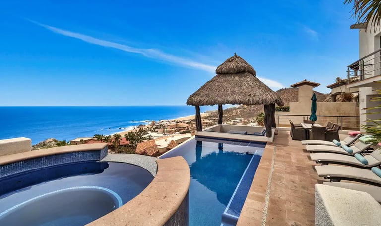 Luxury villa with palapa and infinity pool overlooking the ocean in Pedregal, Cabo San Lucas.