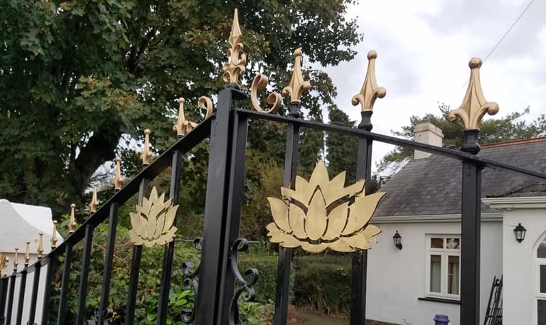 Golden spear top gates with floral detail