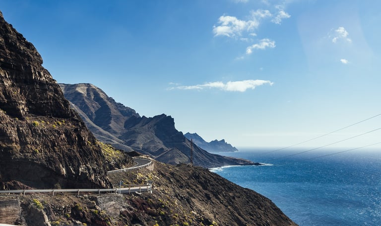 Grand Canary mountains with winding road overlooking water