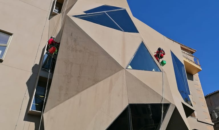 a person on a rope with a person on a rope