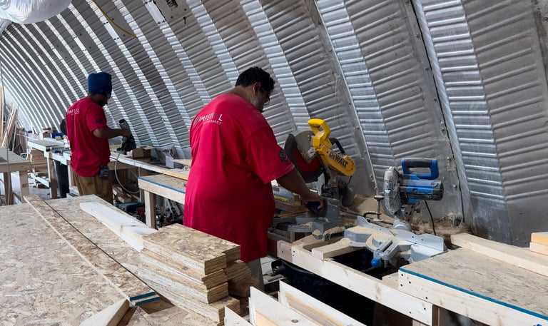 Imperial Custom Sheds crew fabricating custom shed components in workshop
