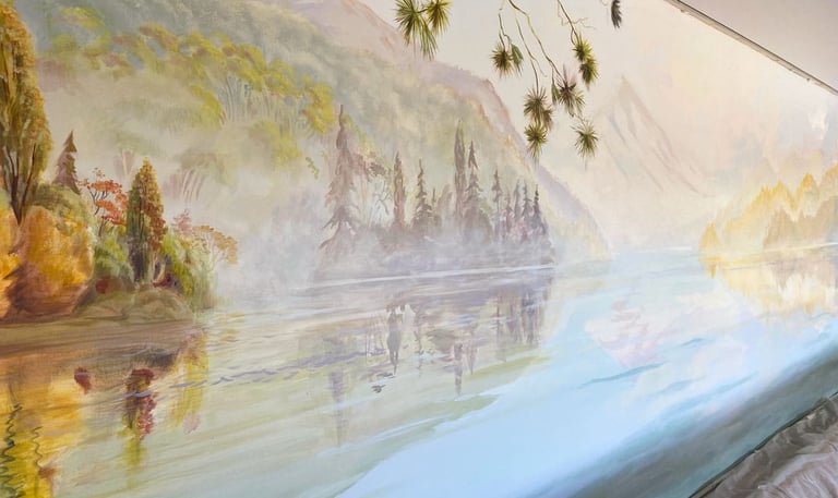 Angled view of pool mural showing New Zealand lake, misty mountains and trees.