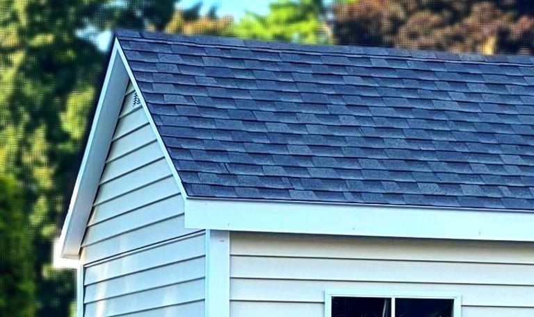 Shed with extended roof overhang built in Massachusetts featuring premium craftsmanship and clean design.