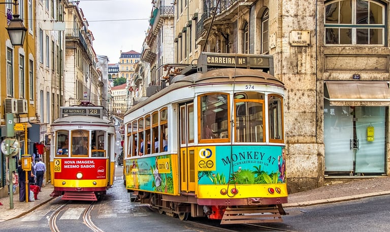Tram running through the streets of Lisbon Portugal