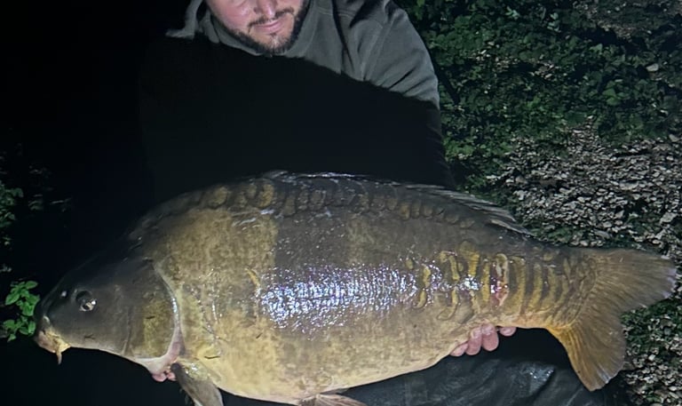 a man holding a fish carp carp carp carp